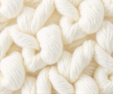 Dettaglio di un tessuto bouclé color avorio